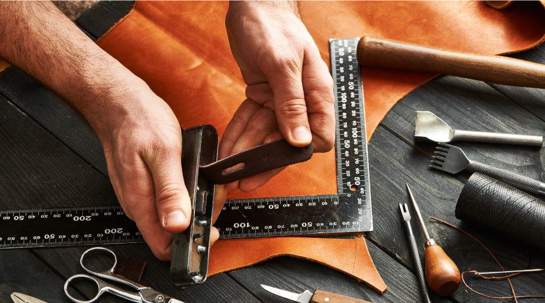 Man cutting leather