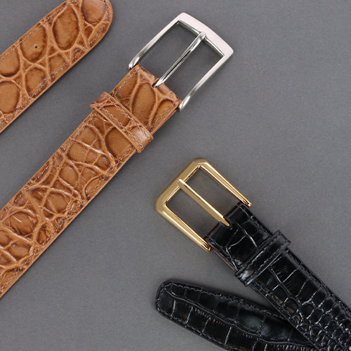 Two mock exotic leather belts