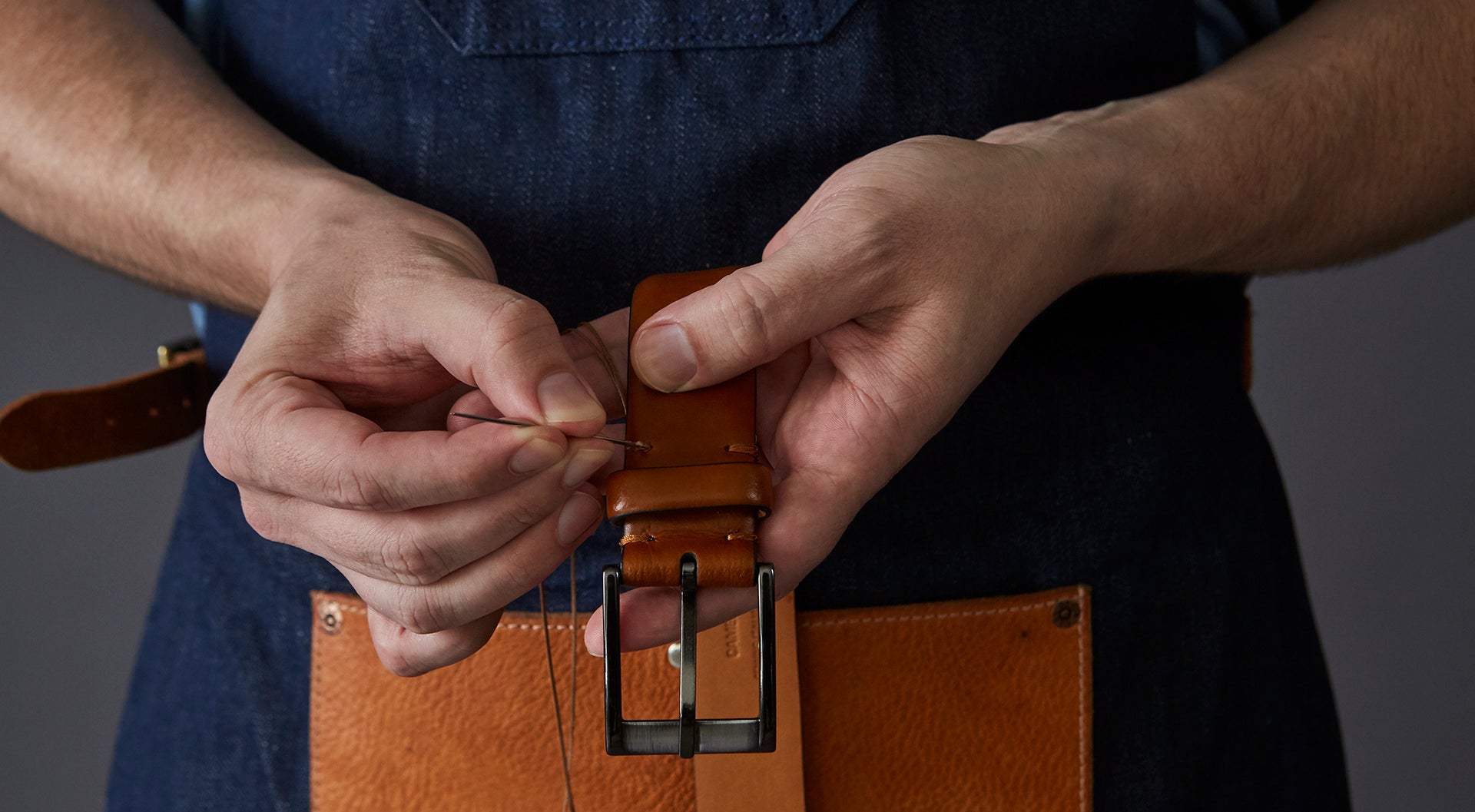 Trafalgar Leather Belt being Hand Sewn by Artisan