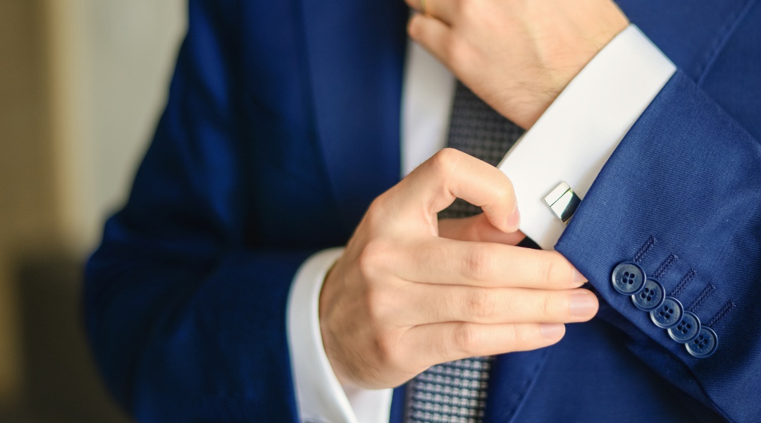 Man adjusting cufflinks