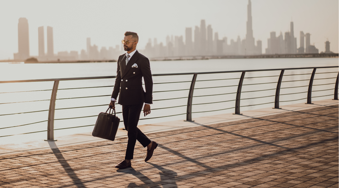 businessman walking with city skyline background