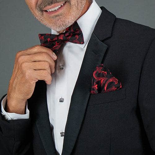 Man wearing a tuxedo with the Christian collection bowtie and pocket square